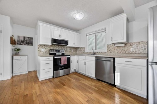 98 Ranch Glen Drive Nw, Calgary, AB - Indoor Photo Showing Kitchen With Upgraded Kitchen
