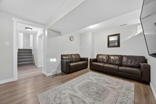 98 Ranch Glen Drive Nw, Calgary, AB - Indoor Photo Showing Living Room