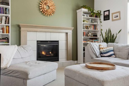 49 Williamstown Green Nw, Airdrie, AB - Indoor Photo Showing Living Room With Fireplace