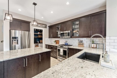 159 Riviera View, Cochrane, AB - Indoor Photo Showing Kitchen With Stainless Steel Kitchen With Upgraded Kitchen