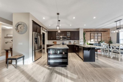 159 Riviera View, Cochrane, AB - Indoor Photo Showing Kitchen With Stainless Steel Kitchen With Upgraded Kitchen