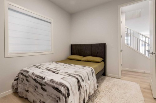 29 Marmot Passage Nw, Calgary, AB - Indoor Photo Showing Bedroom