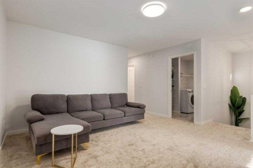 29 Marmot Passage Nw, Calgary, AB - Indoor Photo Showing Living Room
