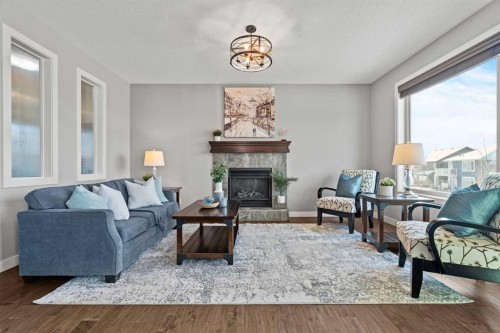 69 Ravenskirk Close Se, Airdrie, AB - Indoor Photo Showing Living Room With Fireplace