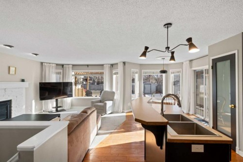 21 Wilson Road Ne, Langdon, AB - Indoor With Fireplace