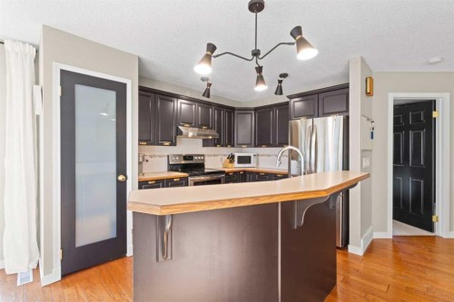 21 Wilson Road Ne, Langdon, AB - Indoor Photo Showing Kitchen With Stainless Steel Kitchen