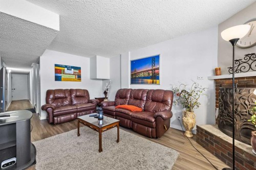 11254 6 Street Sw, Calgary, AB - Indoor Photo Showing Living Room With Fireplace