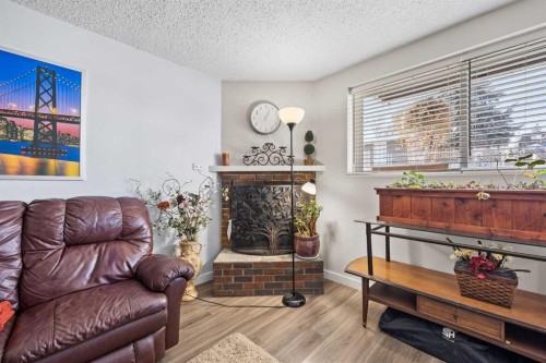 11254 6 Street Sw, Calgary, AB - Indoor Photo Showing Living Room With Fireplace