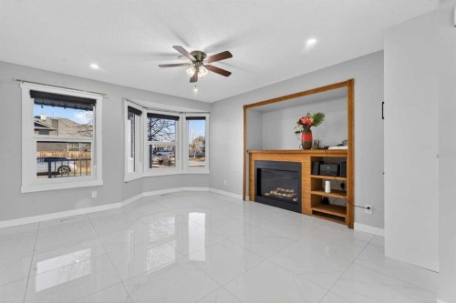 49 Taravista Way Ne, Calgary, AB - Indoor With Fireplace