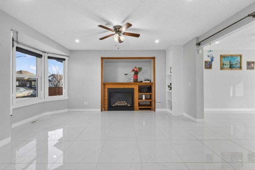 49 Taravista Way Ne, Calgary, AB - Indoor With Fireplace