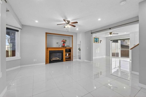 49 Taravista Way Ne, Calgary, AB - Indoor With Fireplace