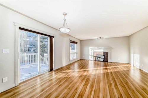1156 Sherwood Boulevard Nw, Calgary, AB - Indoor Photo Showing Living Room With Fireplace