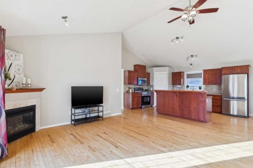 100B Westview Drive, Nanton, AB - Indoor With Fireplace