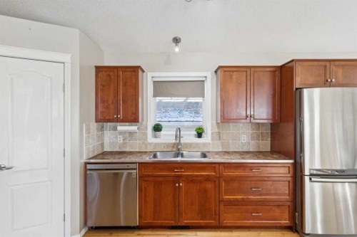 100B Westview Drive, Nanton, AB - Indoor Photo Showing Kitchen With Stainless Steel Kitchen With Double Sink