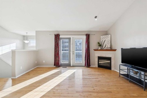 100B Westview Drive, Nanton, AB - Indoor With Fireplace