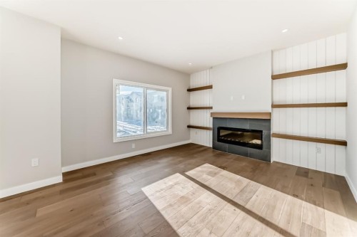 504 Heritage Boulevard, Cochrane, AB - Indoor Photo Showing Living Room With Fireplace