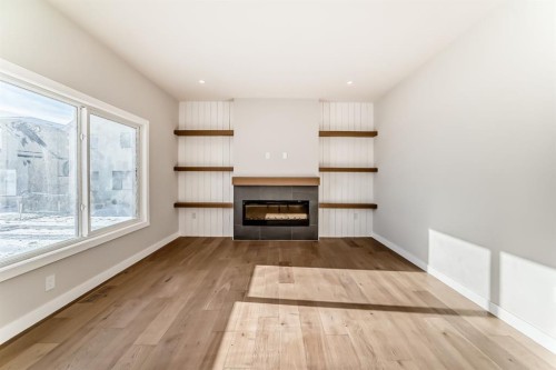 504 Heritage Boulevard, Cochrane, AB - Indoor Photo Showing Living Room With Fireplace