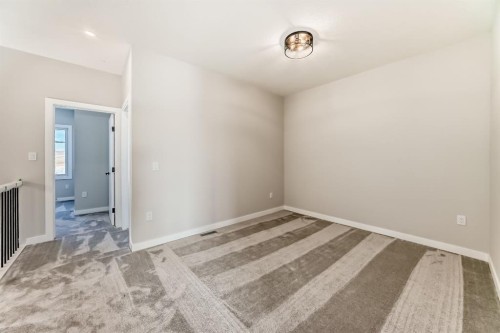 504 Heritage Boulevard, Cochrane, AB - Indoor Photo Showing Other Room