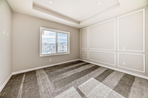 504 Heritage Boulevard, Cochrane, AB - Indoor Photo Showing Other Room