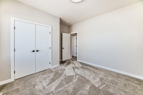 504 Heritage Boulevard, Cochrane, AB - Indoor Photo Showing Other Room