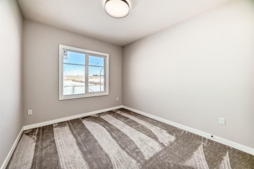 504 Heritage Boulevard, Cochrane, AB - Indoor Photo Showing Other Room