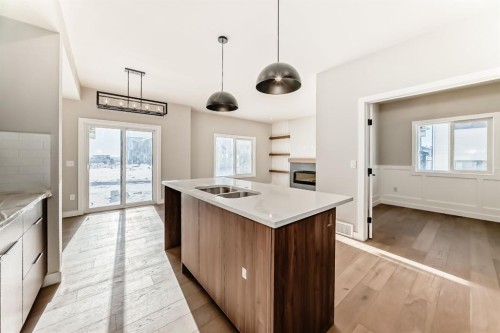 504 Heritage Boulevard, Cochrane, AB - Indoor Photo Showing Kitchen With Double Sink