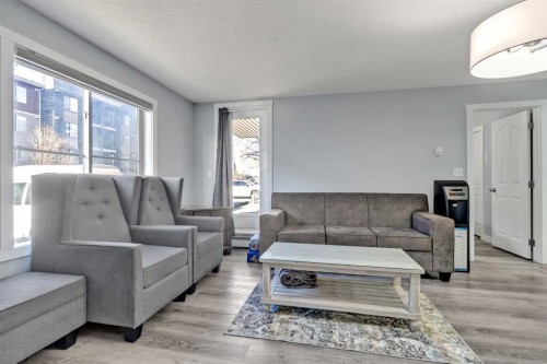 117-7130 80 Avenue Ne, Calgary, AB - Indoor Photo Showing Living Room