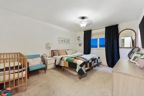 256 Lysander Place Se, Calgary, AB - Indoor Photo Showing Bedroom