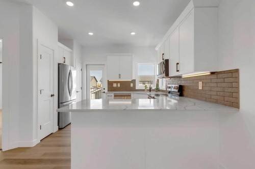 9 Ian Way, Sylvan Lake, AB - Indoor Photo Showing Kitchen With Double Sink With Upgraded Kitchen