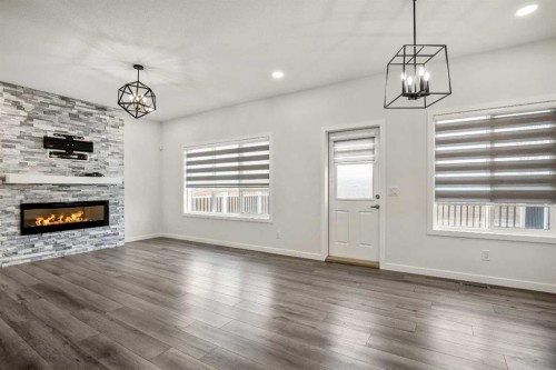 223 Savanna Way Ne, Calgary, AB - Indoor Photo Showing Other Room With Fireplace