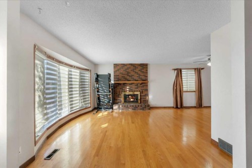 20 Templehill Crescent, Calgary, AB - Indoor Photo Showing Living Room With Fireplace