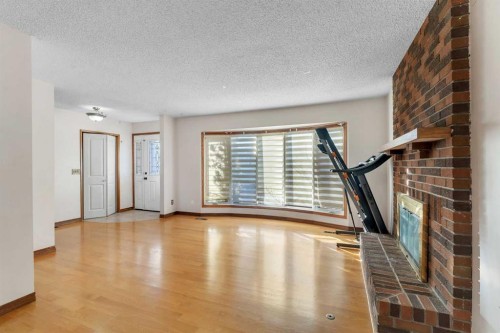 20 Templehill Crescent, Calgary, AB - Indoor Photo Showing Other Room With Fireplace