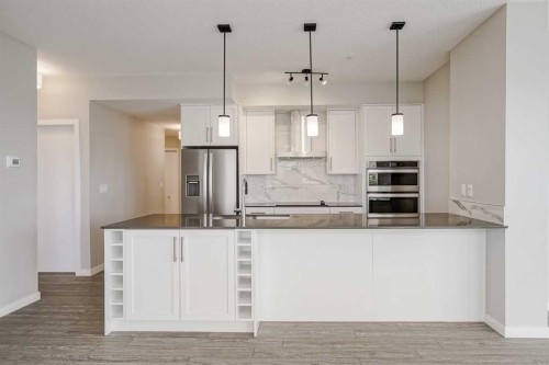 309-2231 Mahogany Boulevard Se, Calgary, AB - Indoor Photo Showing Kitchen With Upgraded Kitchen