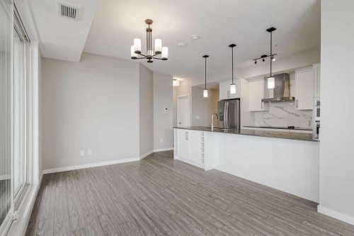 309-2231 Mahogany Boulevard Se, Calgary, AB - Indoor Photo Showing Kitchen With Upgraded Kitchen