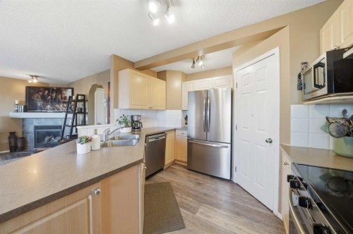 14 Kincora Drive Nw, Calgary, AB - Indoor Photo Showing Kitchen With Stainless Steel Kitchen With Double Sink