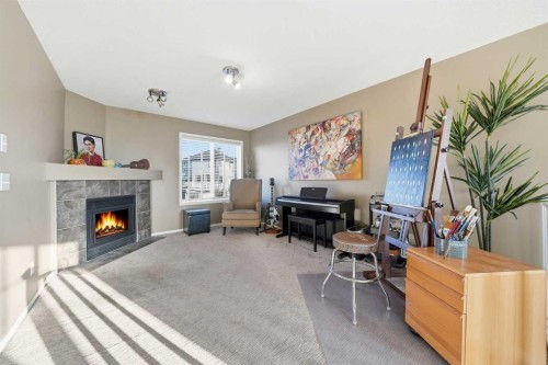 14 Kincora Drive Nw, Calgary, AB - Indoor Photo Showing Living Room With Fireplace