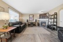 14 Kincora Drive Nw, Calgary, AB  - Indoor Photo Showing Living Room With Fireplace 
