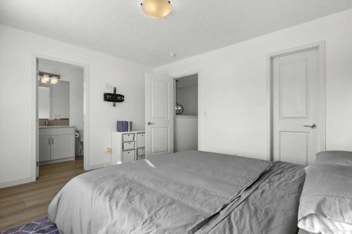 59 Wolf Hollow Way Se, Calgary, AB - Indoor Photo Showing Bedroom