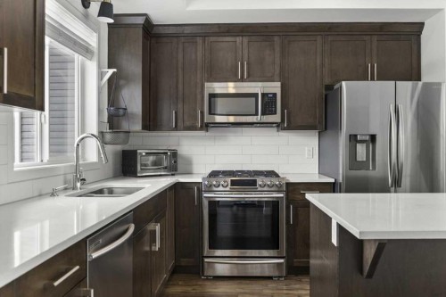 59 Wolf Hollow Way Se, Calgary, AB - Indoor Photo Showing Kitchen With Stainless Steel Kitchen With Double Sink With Upgraded Kitchen