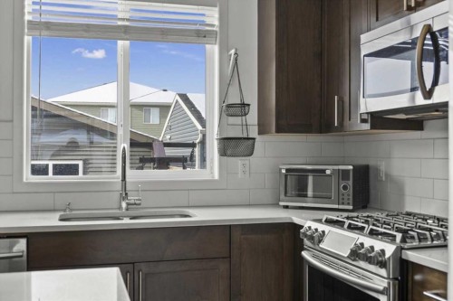 59 Wolf Hollow Way Se, Calgary, AB - Indoor Photo Showing Kitchen With Double Sink With Upgraded Kitchen