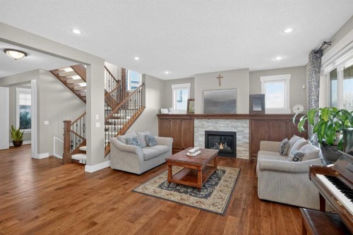 72 Rockcliff Grove Nw, Calgary, AB - Indoor Photo Showing Living Room With Fireplace