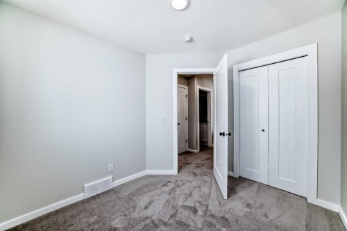 158 Bartlett Crescent Se, Calgary, AB - Indoor Photo Showing Other Room