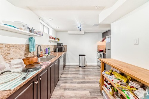 176 Hendon Drive Nw, Calgary, AB - Indoor Photo Showing Kitchen With Double Sink