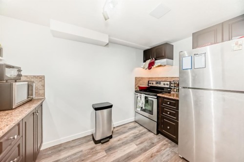 176 Hendon Drive Nw, Calgary, AB - Indoor Photo Showing Kitchen With Stainless Steel Kitchen