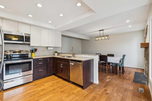 124 Woodmark Crescent Sw, Calgary, AB - Indoor Photo Showing Kitchen With Stainless Steel Kitchen