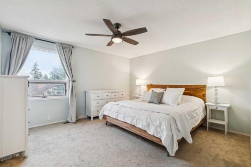 124 Woodmark Crescent Sw, Calgary, AB - Indoor Photo Showing Bedroom