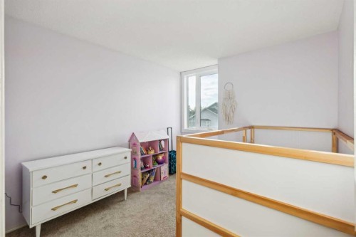 124 Woodmark Crescent Sw, Calgary, AB - Indoor Photo Showing Other Room