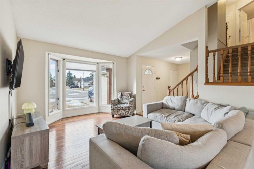 124 Woodmark Crescent Sw, Calgary, AB - Indoor Photo Showing Living Room