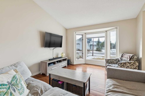 124 Woodmark Crescent Sw, Calgary, AB - Indoor Photo Showing Living Room