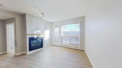 121-69 Springborough Court Sw, Calgary, AB - Indoor With Fireplace
